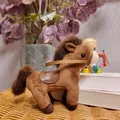 Adorable brown plush horse toy with a leather saddle standing on a wicker surface - Brown Horse / 12cm Pendant / Brown