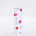 Detailed view of 20oz skinny tumbler with red Christmas gingerbread and tree patterns - Style 6 (White Gingerbread Man)