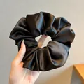 Elegant oversized black satin scrunchie with a soft silk-like sheen for hair styling - 13cm / Black