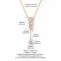 Detailed gold plated heart pendant necklace showing precise measurements and zircon details - Heart Zirconia Four-Stone Vertical Tassel Necklace / Gold