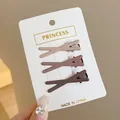 Set of three matte earthy tone X-shaped metal hair clips for girls on white display card - Crossed / Three-Piece Set / Morandi Tones (Apricot/Bean Paste/Dark Coffee)