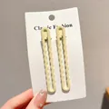 Pair of elegant pale yellow wavy matte hair clips for women and kids on white card - Wavy Snap Clip / 1 Pair/Pack (8.3cm) / Beige