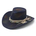 Close-up of vintage navy blue cowboy hat with distressed Maillard finish and evil eye charm. - M / Blue