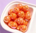 Close-up of 16mm shiny orange UV electroplated acrylic beads for DIY jewelry making - 1 Piece / Orange