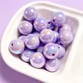 Macro view of 16mm purple UV-plated acrylic beads with iridescent rainbow luster for DIY crafts - 1 Piece / Purple