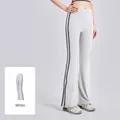 Athletic white high-waist yoga flare pants featuring black side stripes and elastic fit - S / Bottoms / White