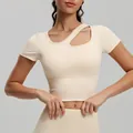Slim fit cream short sleeve yoga top featuring an asymmetrical neck cutout and built-in pads - S / Tops / Ivory