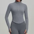 Slim fit grey yoga jacket with stand collar, corset-style waist, and thumbhole details - S / Tops / Sun Grey
