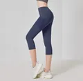 High Waist Yoga-Caprihose mit Seitentaschen in Marineblau für Fitness und Training im Gym - S / Unterteile / Walblau