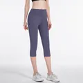 High-waisted eggplant purple yoga capris with peach lift effect for workout and running - Sauce Purple