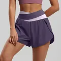 Women's purple color-block yoga shorts featuring a high-waist crisscross pink waistband - Eggplant Purple