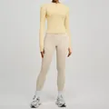Completo sportivo per yoga: giacca gialla con zip e leggings beige elasticizzati - Taglia S / Top E Pantaloni / Giallo sole + Bianco avorio