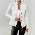 Detailed view of elegant white textured blazer with cable knit patterns and buttons - S / Tops / White