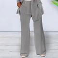 Detailed view of women's grey wide-leg suit trousers and slim-fit blazer outfit. - S / Bottoms / Gray