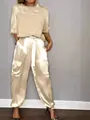 Detailed view of women's elegant champagne satin two-piece set with cargo style pants. - S / Top And Bottom / Apricot