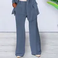 Detail showing the slim fit and blue fabric of the women's 2-piece business suit set. - S / Bottoms / Blue