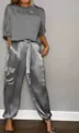 Detailed view of elegant women's grey satin two-piece outfit featuring chic cargo pants - S / Top And Bottom / Gray