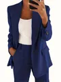 Detalle de un traje azul marino para mujer con chaqueta de solapa y pantalón a juego elegante. - S / Tops / Azul Marino
