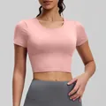 Eng anliegendes rosa kurzärmeliges Yoga-Crop-Top mit integrierten Brustpolstern für Fitness - S / Oberteile / Barbie-Rosa