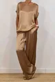 Detail of elegant bronze satin loose shirt and wide-leg trousers loungewear set. - XS / Top And Bottom (03076) / Dark Brown