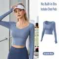 Women's grey lake blue long sleeve yoga crop top featuring built-in pads and criss-cross neckline - Grayish Blue