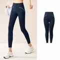 Slankvallende marineblauwe yoga legging met hoge taille en witte biezen voor sport - S / Bottoms / Marineblauw