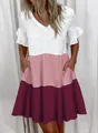 Detailed view of women's tiered color-block summer dress with V-neck and pockets - Pink