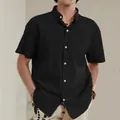 Front view of men's black cotton linen casual shirt with stand collar and pocket - M / Tops / Black