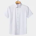 Classic white short-sleeved business dress shirt for men presented on a wooden hanger - S / Tops / White