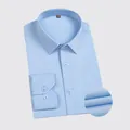 Men's light blue long-sleeve business dress shirt in a professional folded view. - Light Blue
