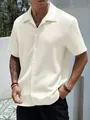 Detailed macro view of the cream waffle knit texture on men's summer casual shirt - S / Tops / Off White