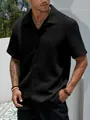 Vista ravvicinata di camicia casual nera da uomo in tessuto con trama a rilievo - Taglia S / Top / Nero