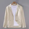Close-up of men's beige cotton linen blazer featuring notch lapels and patch pockets. - M / Tops / Off White