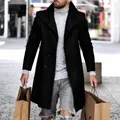 Close-up of men's black mid-length wool coat with wide lapels and button detail - S / Tops / Black