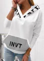 Close-up detail of white women's hoodie featuring a sequined INVT letter print pocket design - S / Tops / White
