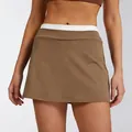 Detail view of high waist brown athletic tennis skort with white ribbed waistband - S / Bottoms / Brown
