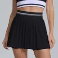 Close-up detail showing the high-waist pleated black tennis skirt with sport stripes. - S / Bottoms / Black