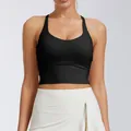 Detail view of the black sports bra with fixed pads and cross-back design. - S / Tops / Jasper Black