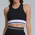 Close-up detail of breathable black sports crop top with striped white elastic band - M / Tops / Black