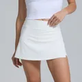 High-waisted white athletic tennis skort with breathable fabric for outdoor fitness - S / Bottoms / Ivory