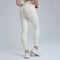 High-waisted cream yoga leggings made of quick-dry fabric for gym workout and running - S / Bottoms / Pants / Light Ivory