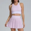 Light pink two-piece sports set with a high-waisted pleated tennis skirt and racerback top - L / Top And Bottom / Pink