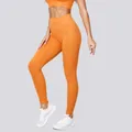Leggings da yoga a costine senza cuciture a vita alta in arancione vibrante per il fitness - Taglia S / Pantaloni e gonne / Giallo Arancione
