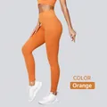 High-waisted seamless ribbed yoga leggings in vibrant orange for professional women fitness - S / Bottoms / Yellow Orange