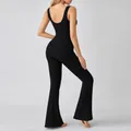 Dames jumpsuit voor yoga in zwart ribgebreid met U-hals en uitlopende pijpen en open rug - S / Boven- en Onderkant / Zwart