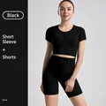 Black two-piece ribbed yoga set featuring short sleeve crop top and drawstring shorts - S / Top And Bottom / Short Sleeve + Shorts / Black