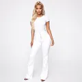 Full body view of a professional model wearing white high-waist button-fly flare jeans. - S / Bottoms / White