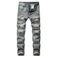 Macro view of distressed details on blue slim fit ripped straight denim jeans for men - 28 / Bottoms / Retro Wash Blue
