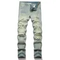 Dettaglio di jeans strappati slim fit da uomo blu chiaro con motivi invecchiati - Giallo Fango