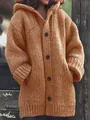 Detailed view of a brown hooded knitted cardigan featuring large black buttons and chunky texture - S / Tops / Orange